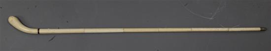 A 19th century turned and carved ivory walking stick, 35in.